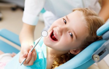 Little girl sitting in the dentists office; Shutterstock ID 153165995; PO: 100 47953; Job: Shutterstock; Other: Public Affairs